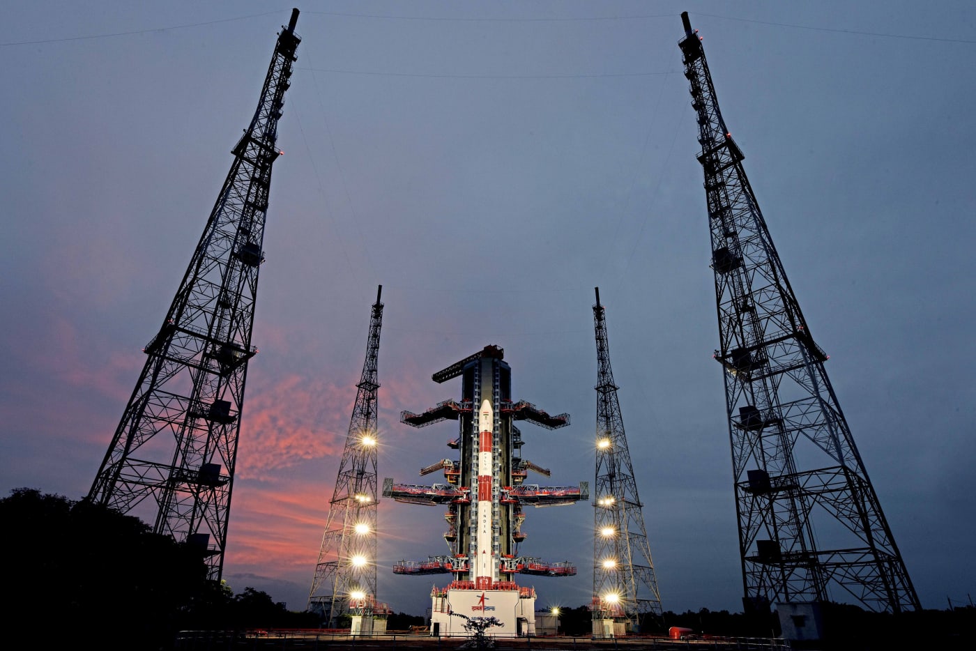 The fully integrated PSLV-C53 stands on the Second Launch Pad at Sriharikota as evening falls.