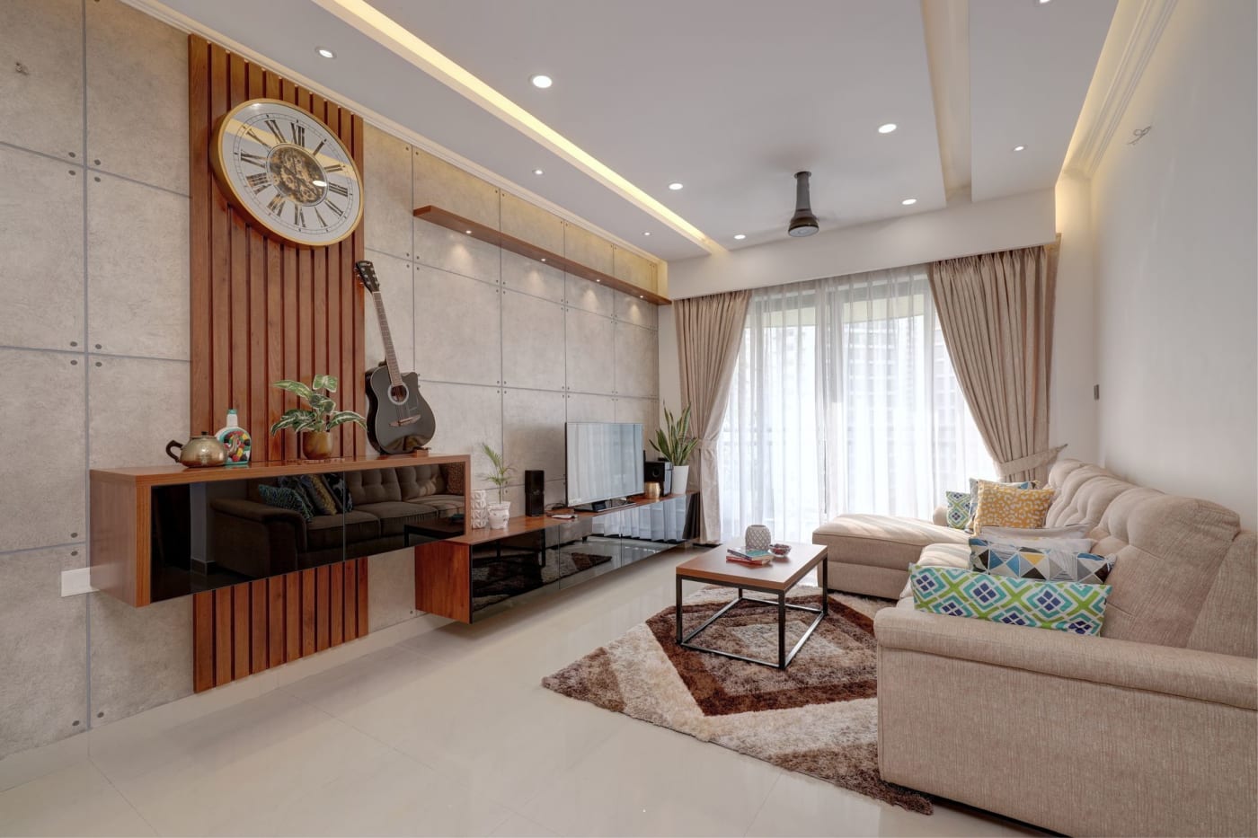 A living room with modern wooden furniture in Kochi, Kerala.