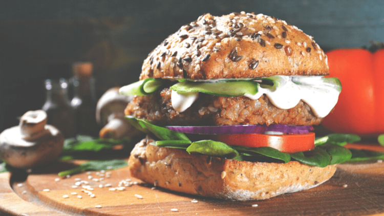 Vegan burger in a seeded bun with fillings 