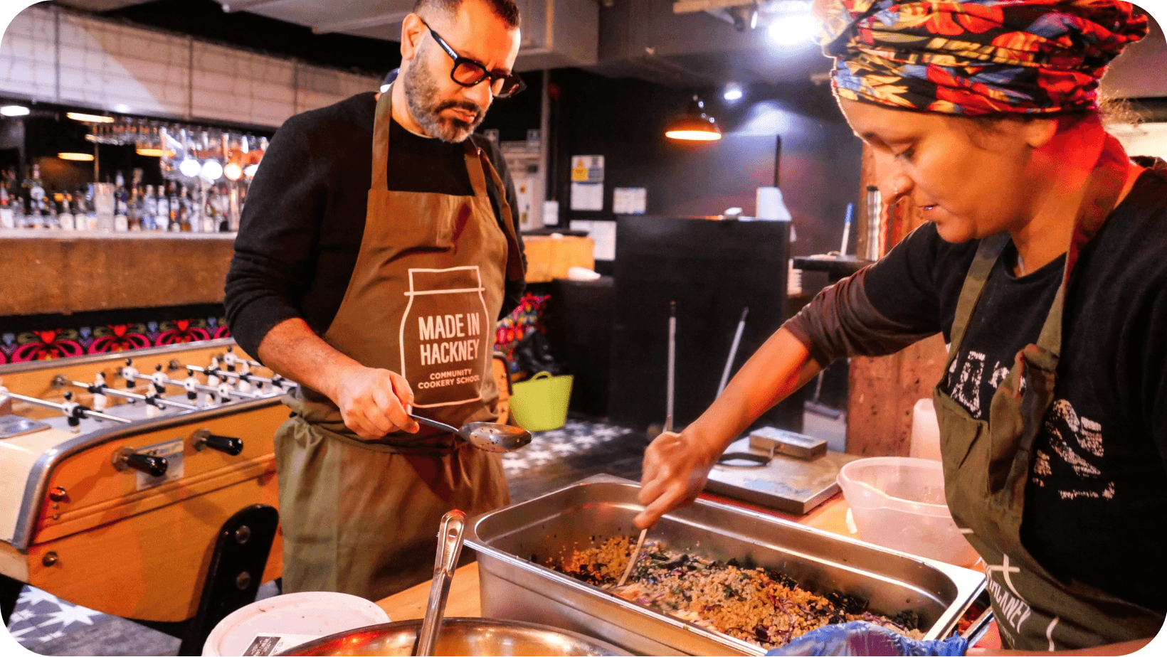 Man and woman cooking in Made in Hackney Kitchen