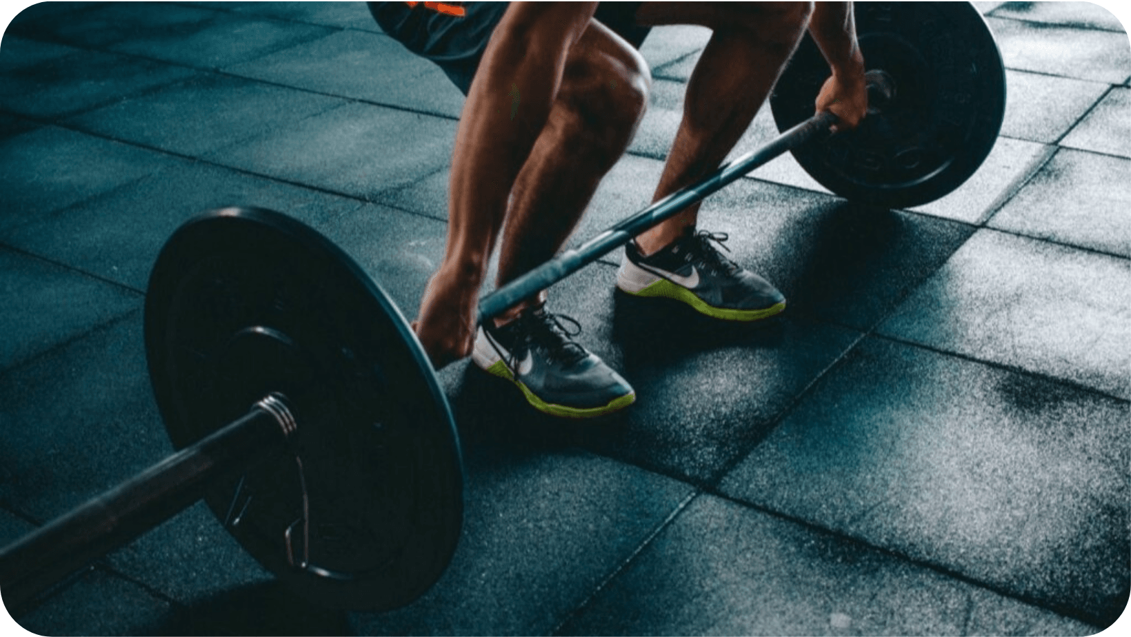 Man deadlifting a barbell