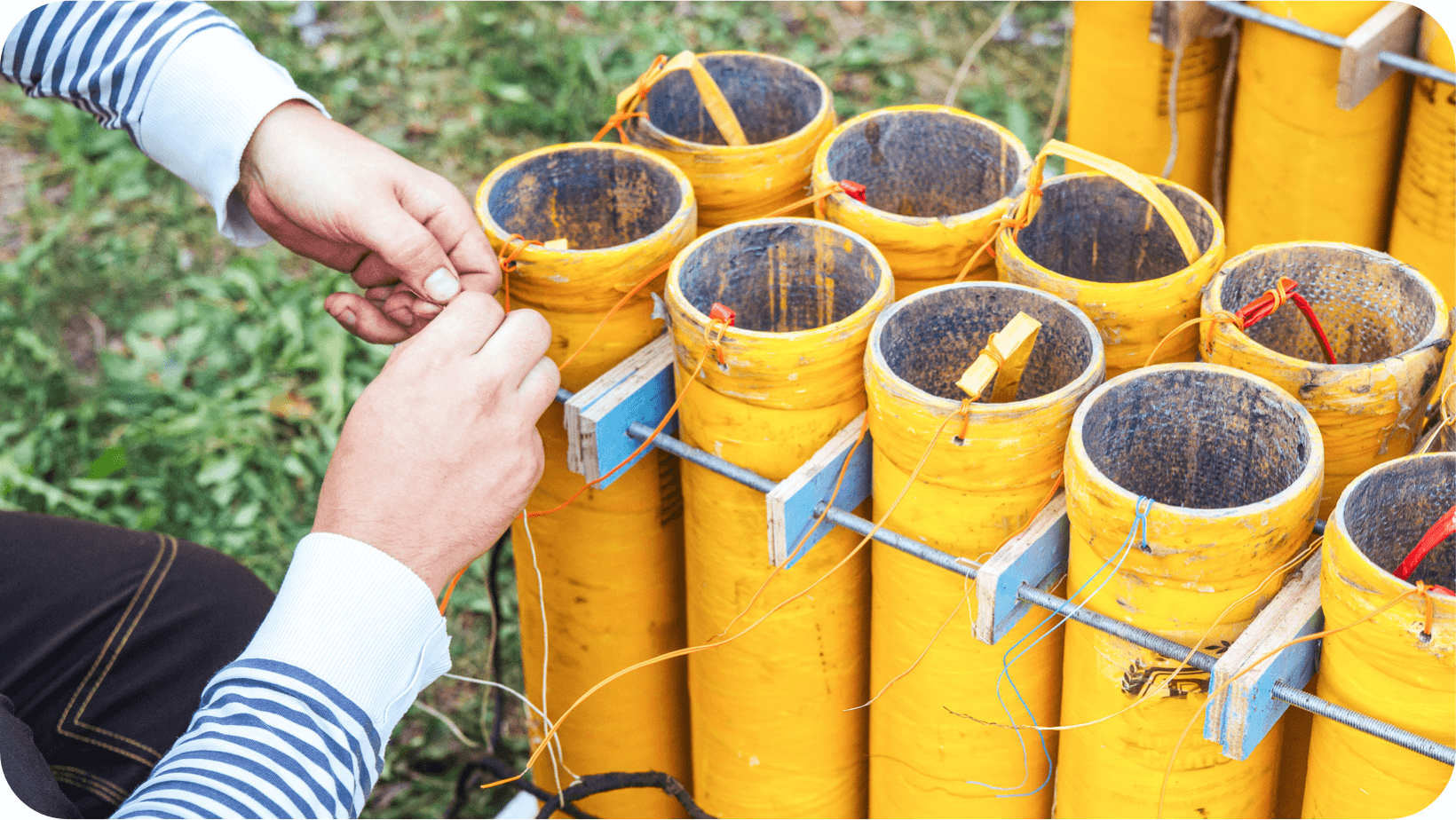 A collection of yellow fireworks about to be lit