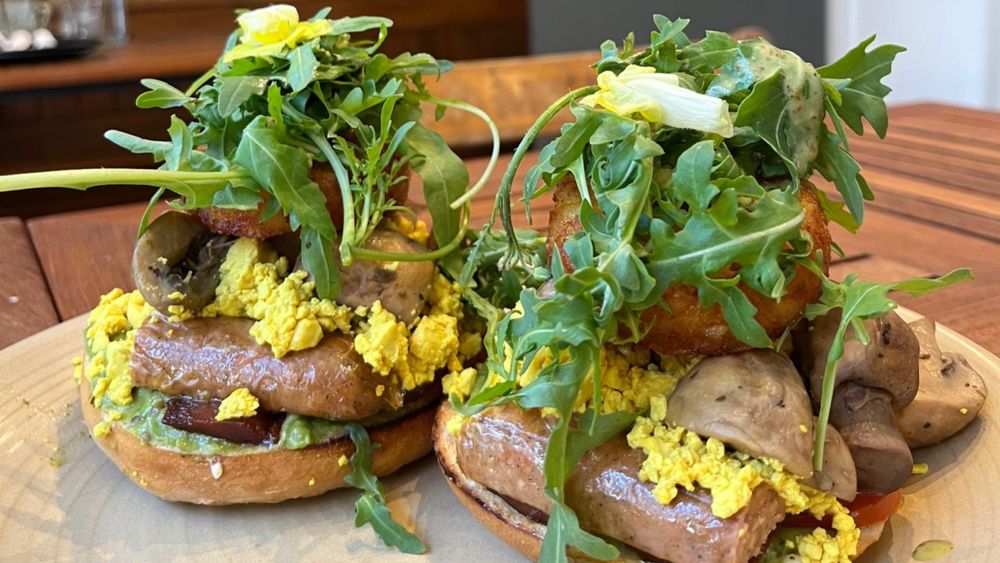 vegan full english breakfast on a bagel in a vegan cafe