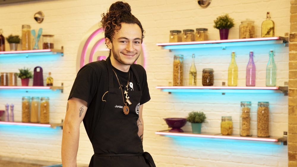 Jordan Pomerance smiling wearing black in the YoungMasterchef studio after being awarded as a finalist