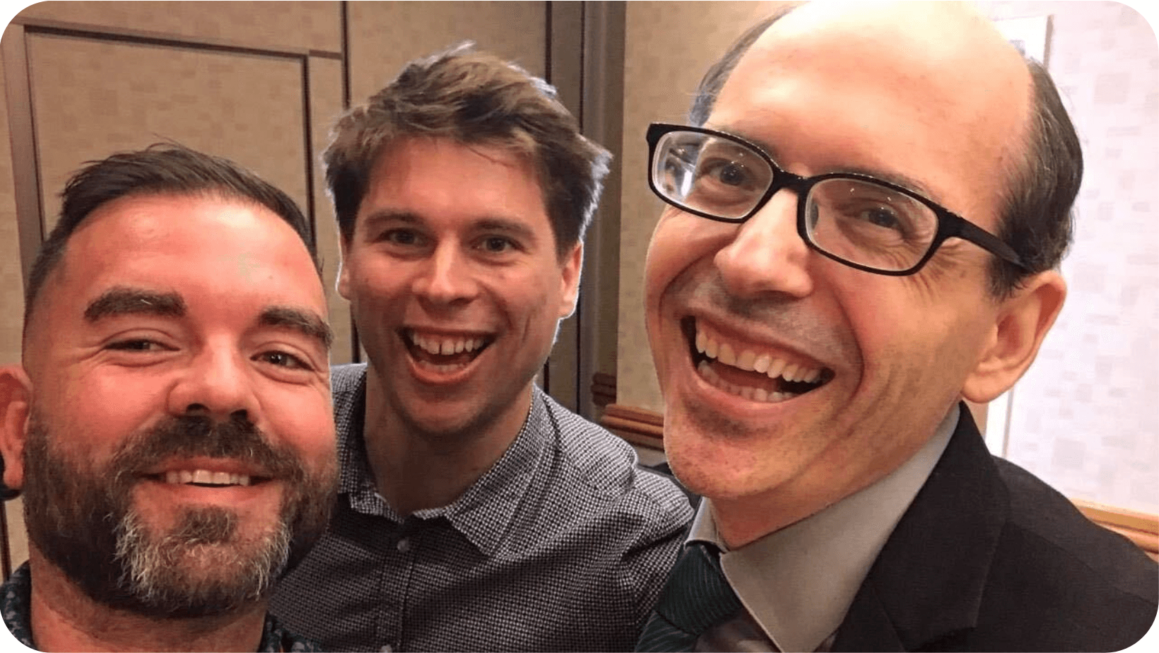 Selfie taken of Robbie Lockie, Klaus Mitchell and Dr Michael Greger all smiling 