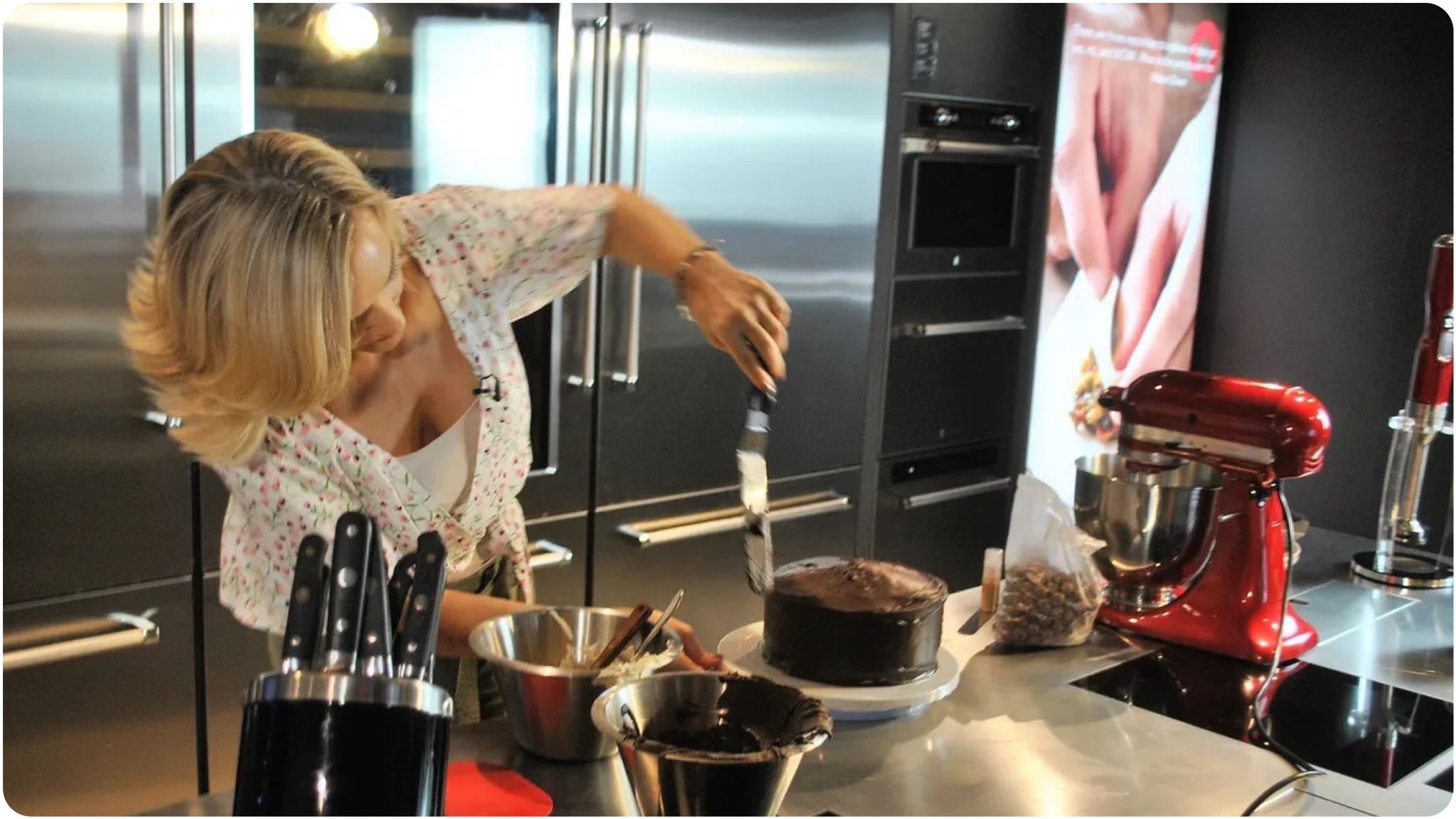 Woman (Lisa Marley) baking a cake in her kitchen