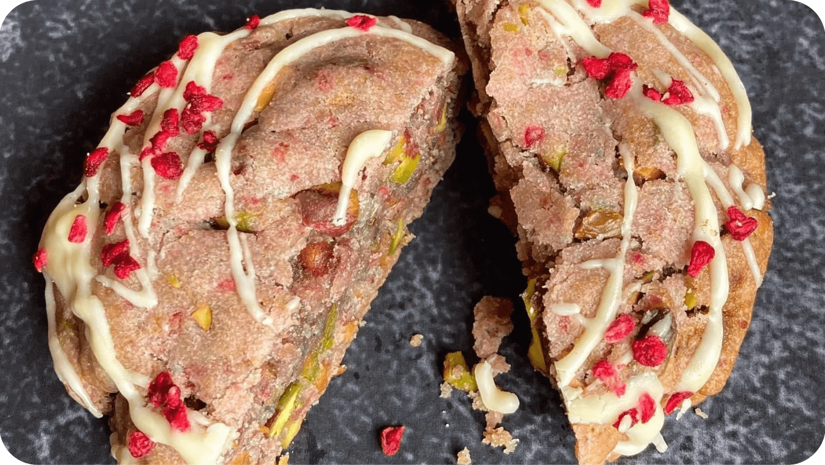 Vegan raspberry and pistachio cookie from Jostle Bakers cut in half