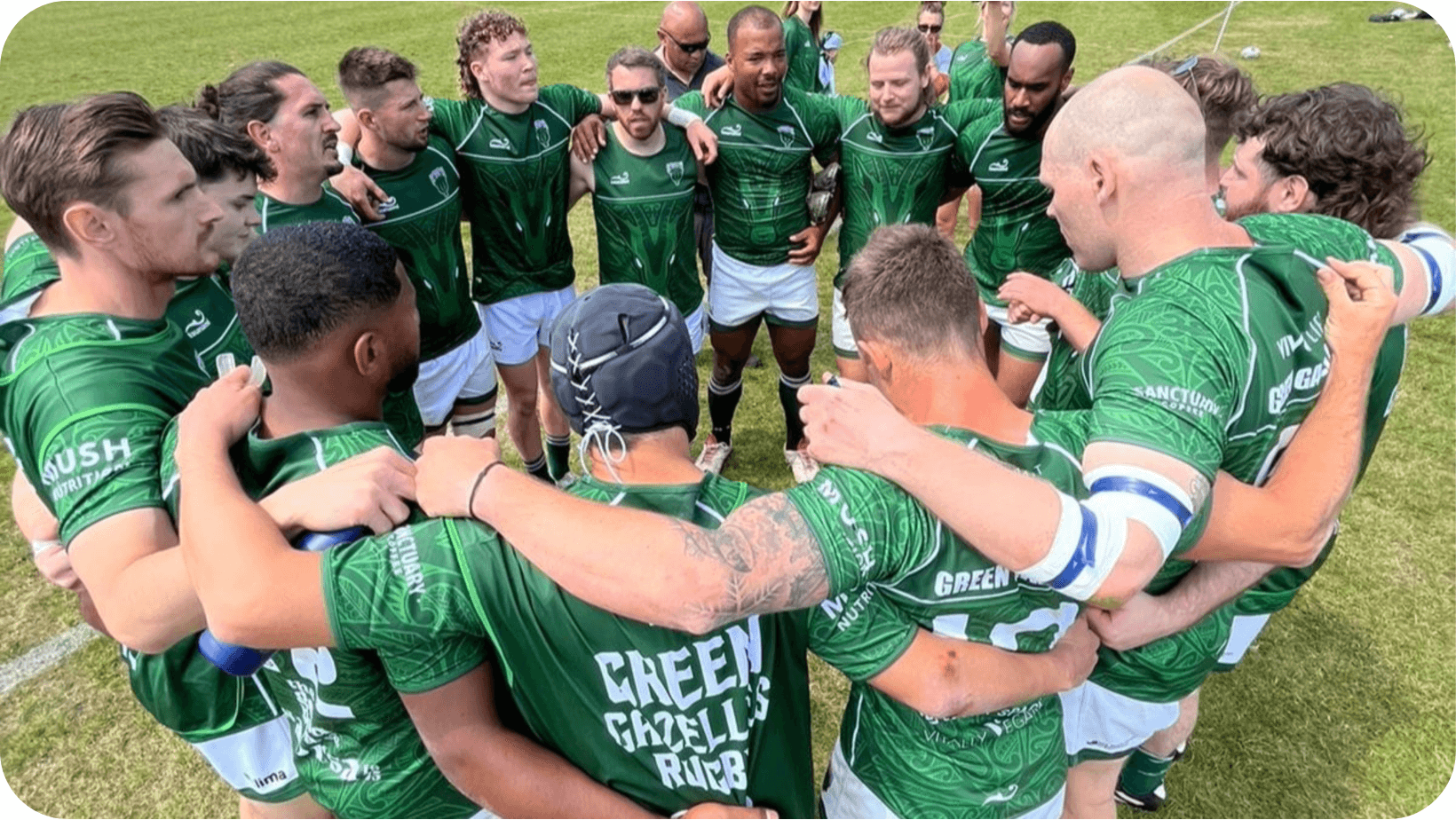 Group of vegan rugby players in a team huddle wearing their Green Gazelles rugby tops