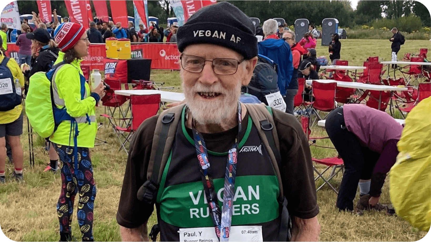 Paul Youd smiling before running a marathon, wearing a Vegan Runners shirt