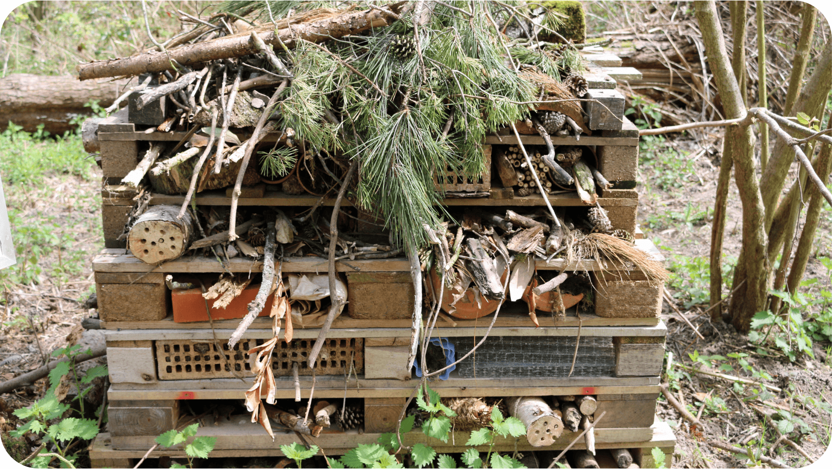 A bug hotel made from wood, bricks and natural materials