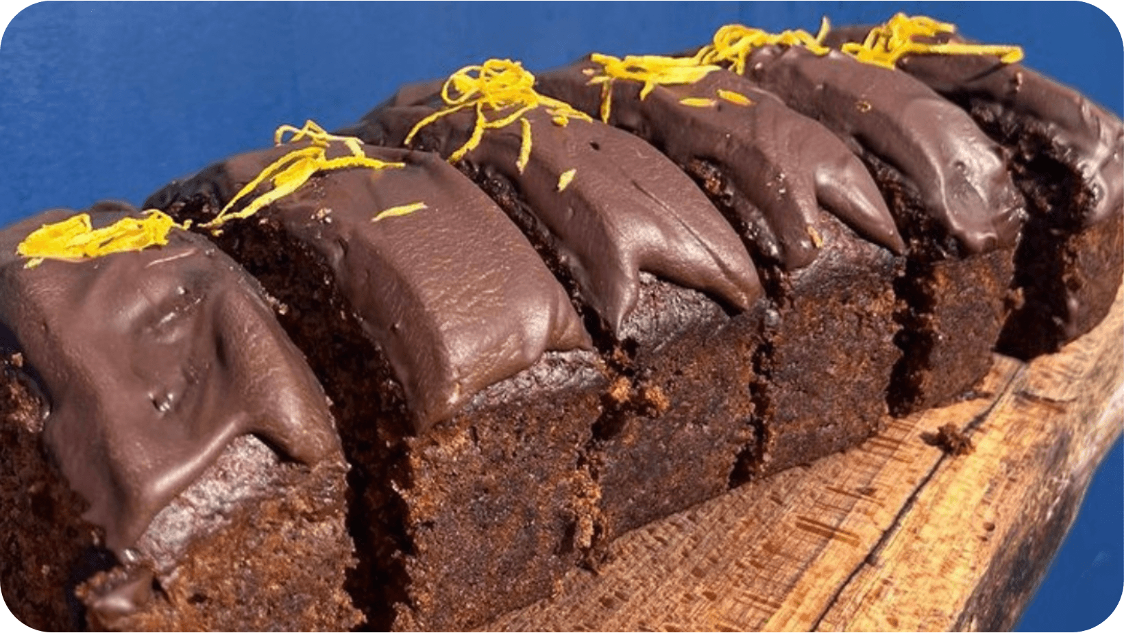 Six slices of vegan Chocolate Orange Banana Bread on a wooden surface from SLICE, Dublin