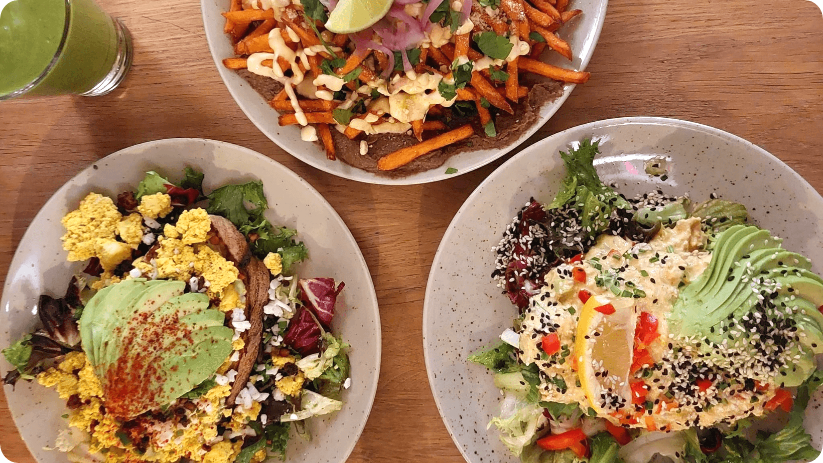 Loaded sweet potato fries and vegan tuna on toast with avocado and salad from Maholo, Stockholm.