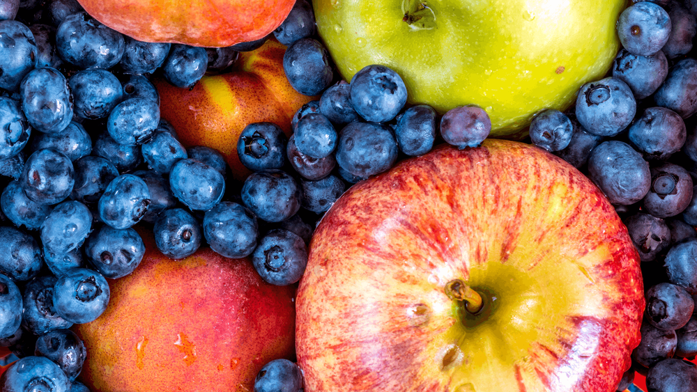 Close-up of vibrant blueberries and apples