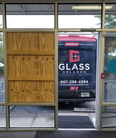 after hours emergency board-up service on a commercial storefront window in Orlando Florida