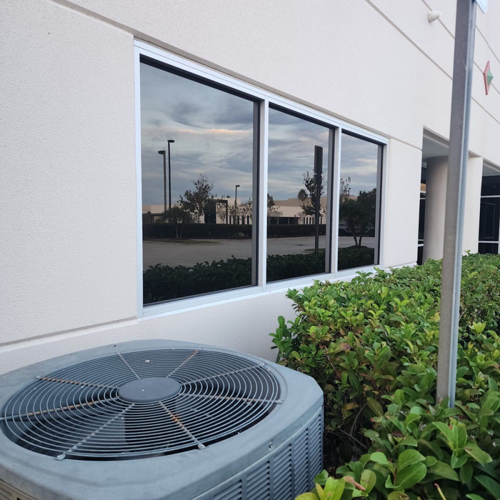 Repaired aluminum storefront systems along retail plaza in Central Florida