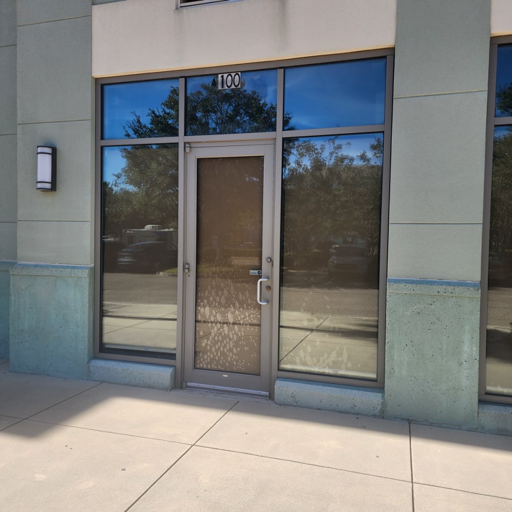 Professional emergency board-up on commercial glass door after vandalism in Central Florida