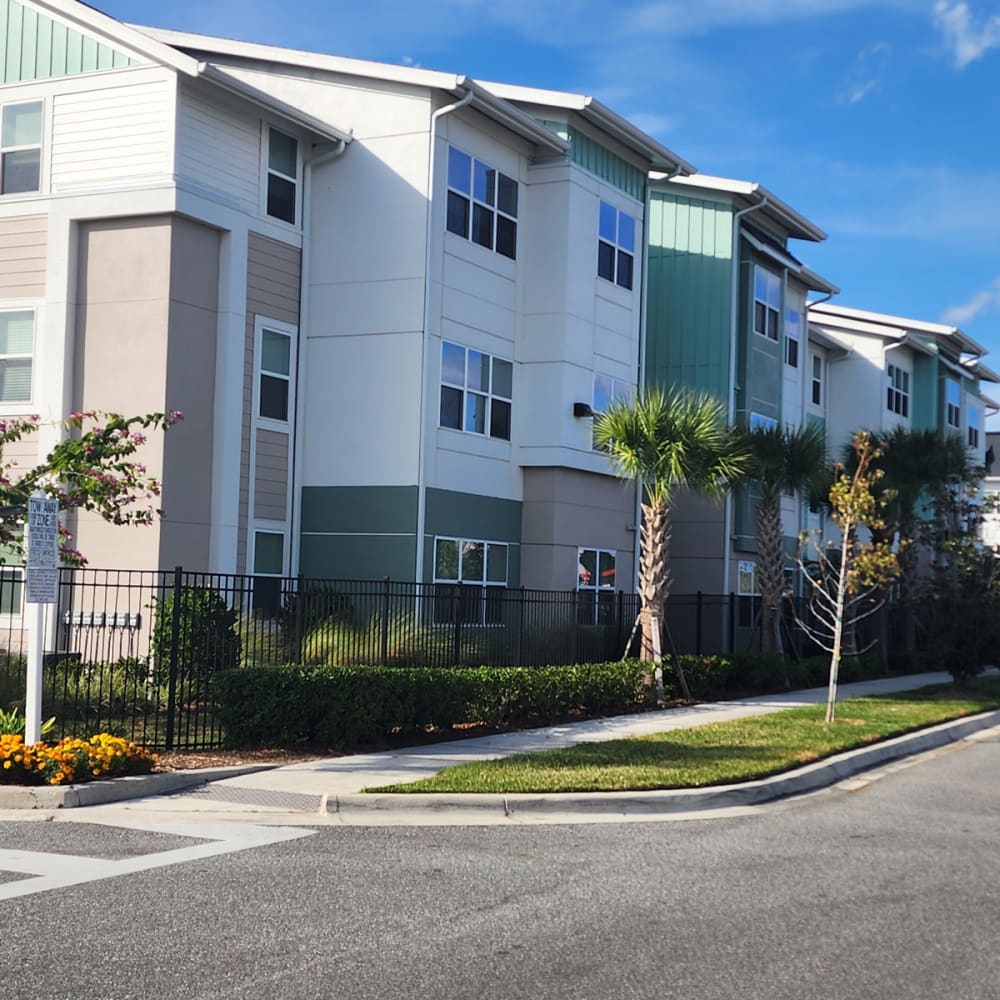 Apartment building with multiple balcony doors and common-area windows managed by a property management company in Orlando