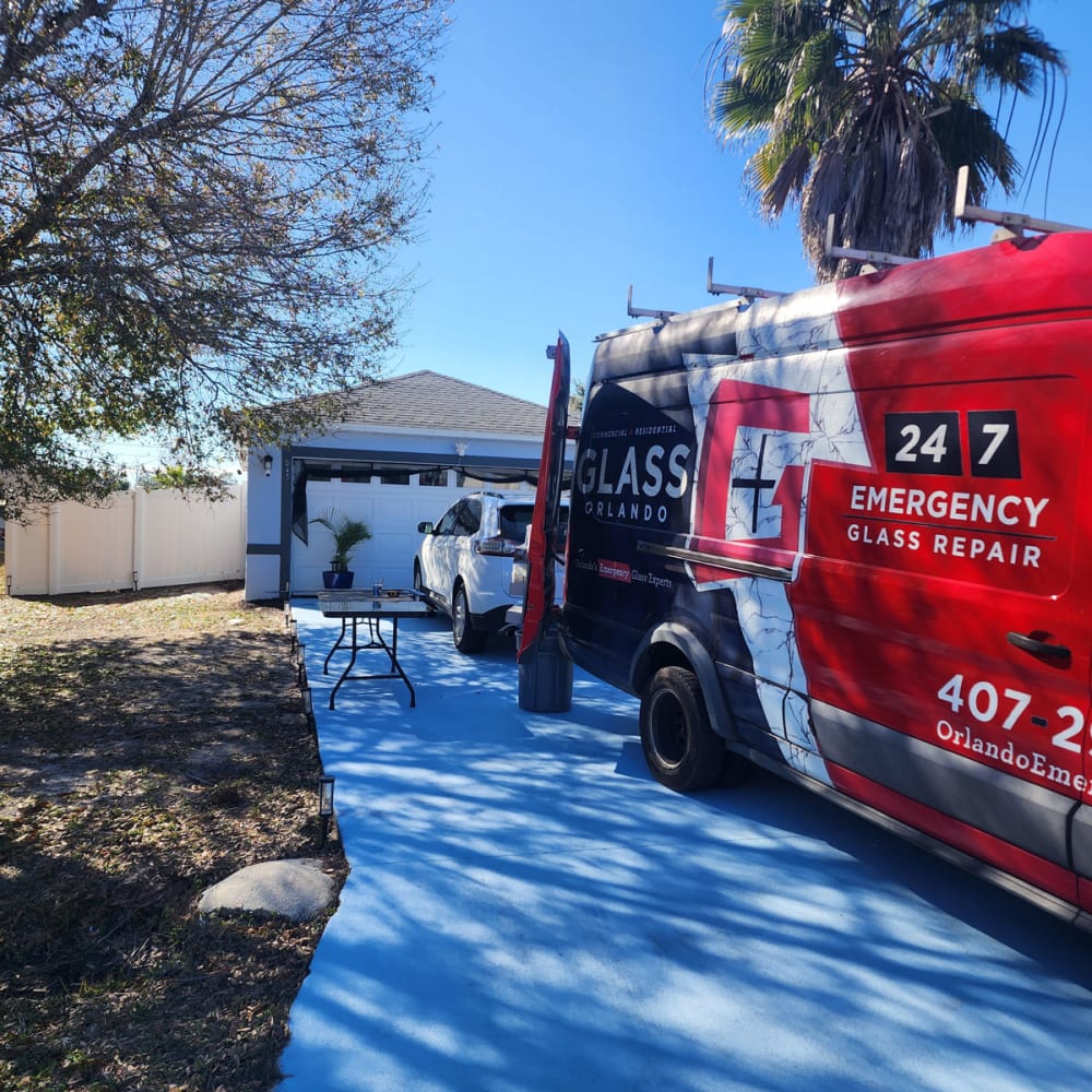 Glass service van parked near a condo and office building in Altamonte Springs representing mobile repair service