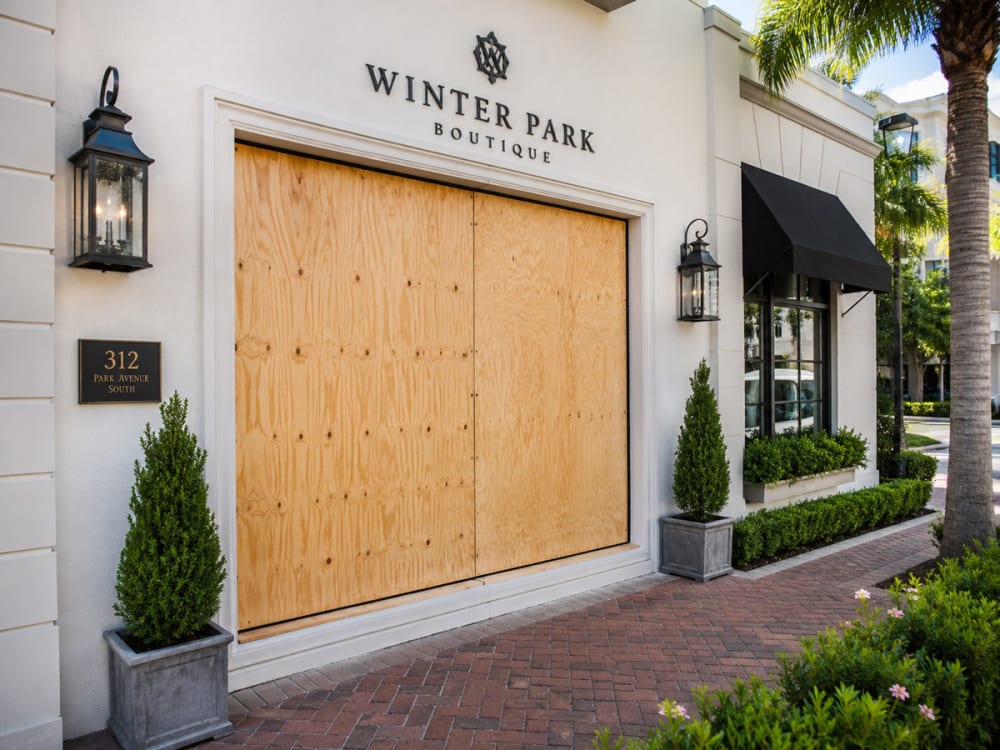 Emergency board-up on a broken glass opening in Winter Park after storm, accident, or break-in damage