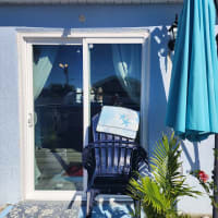Five-star review from an Orlando homeowner praising tempered sliding door safety glass replacement