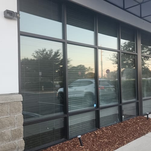 Fogged insulated storefront glass unit replaced at Winter Park boutique. Click to open in modal.