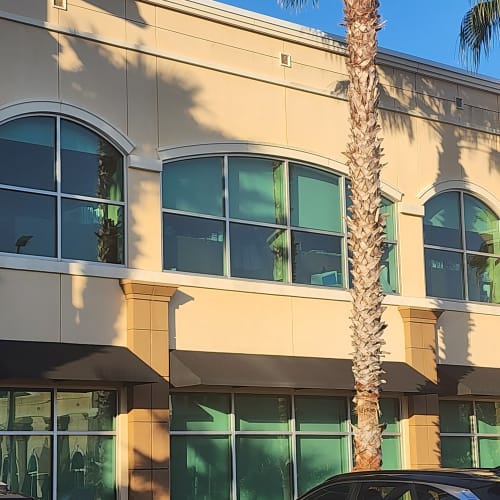 commercial insulated glass panel replaced on mid level of Orlando office building. Click to open in modal.