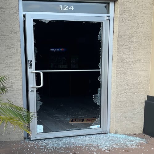 Altamonte Springs strip center entry glass door restored after crack across the center. Click to open in modal.