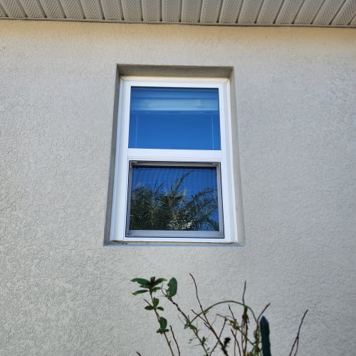 Tempered custom window glass installed next to a bathroom tub in Apopka to meet safety code.. Click to open in modal.
