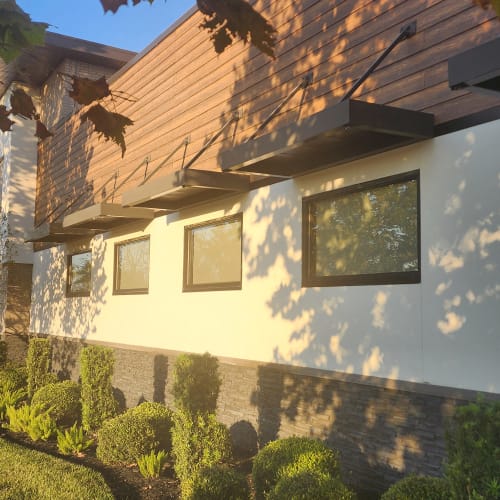 Row of impact glass windows along the back of a Conway home in southeast Orlando. Click to open in modal.