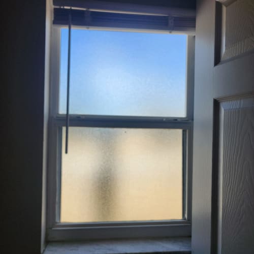 Tempered privacy glass window installed near a shower in a Wekiva Springs bathroom. Click to open in modal.