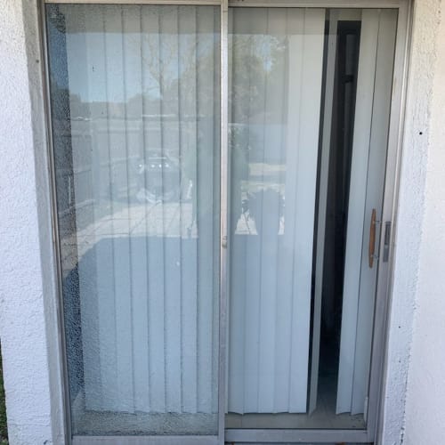 Tempered glass patio door in an Orlando home providing safe backyard access. Click to open in modal.