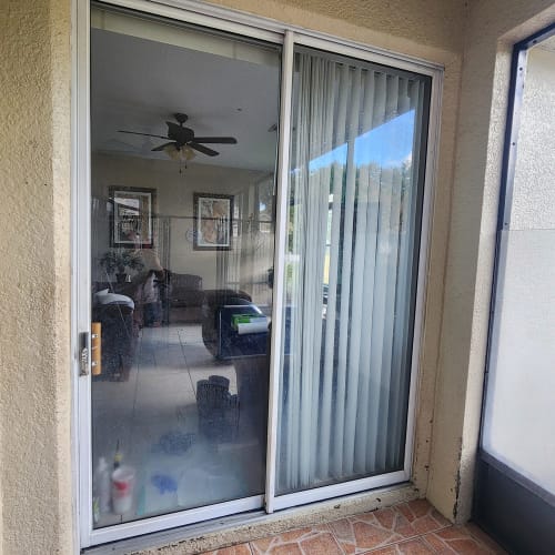 Orlando family room sliding door with repaired hardware and clear glass panel. Click to open in modal.