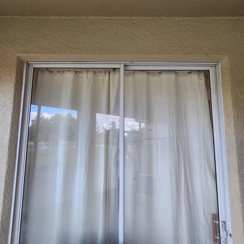 Townhome patio slider in Winter Garden operating smoothly after full hardware tune-up. Click to open in modal.