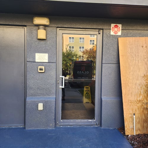 Boarded storefront in Altamonte Springs after emergency glass damage. Click to open in modal.