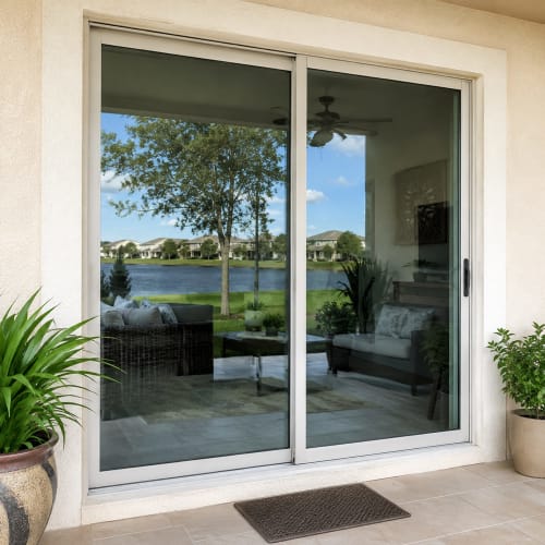 Sliding glass door in Kissimmee with replacement glass installed. Click to open in modal.