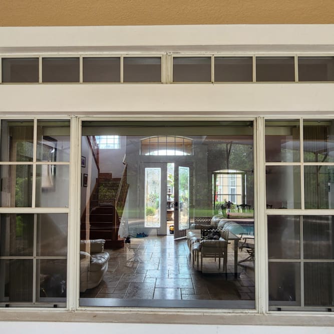 Large picture window with spreading crack replaced in Lake Nona Florida. Click to open in modal.