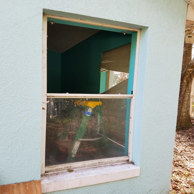 Cracked single-hung window glass replaced in a Sanford Florida residence. Click to open in modal.