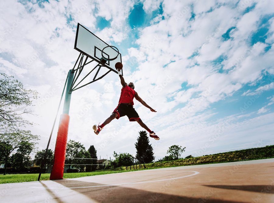 Outdoor basketball court game at night in Changsha shot in black and white