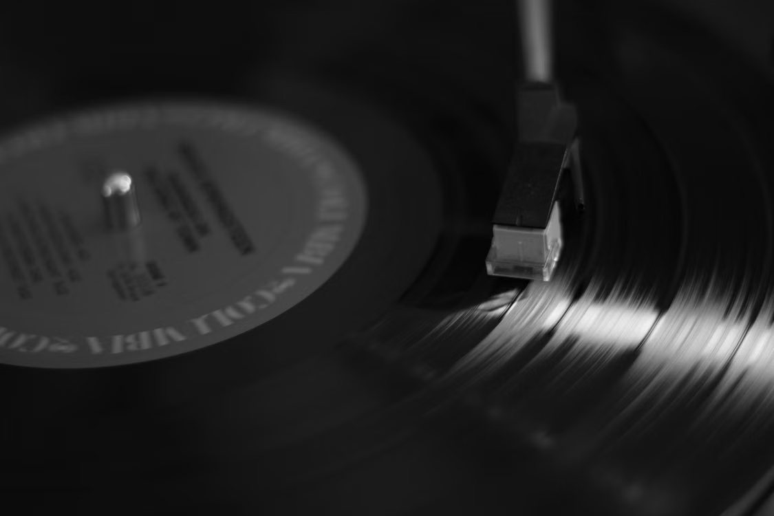 Vintage vinyl record player and a burnin album cover in high contrast black and white