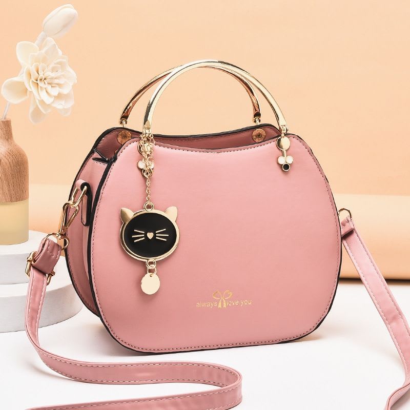 Sac à main rond avec pendentif chat - plusieurs couleurs disponibles
