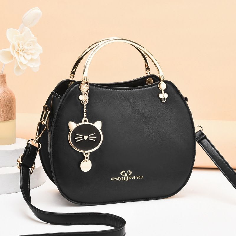 Sac à main rond avec pendentif chat - plusieurs couleurs disponibles