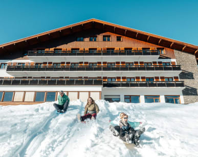 Sledging in front of the Chalets du Prariand