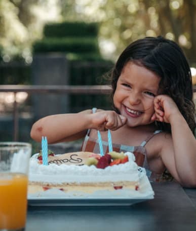 child and birthday cake