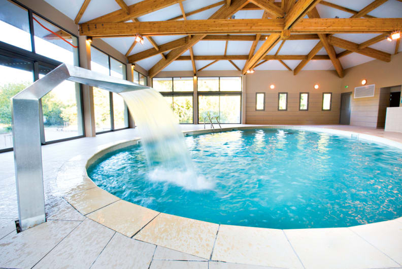 Indoor swimming pool of the Domaine de Château Laval***