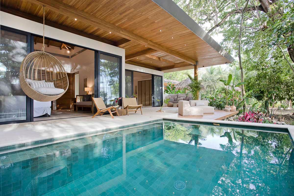 Pool area in Casa Pasha, Santa Teresa, surrounded by gardens