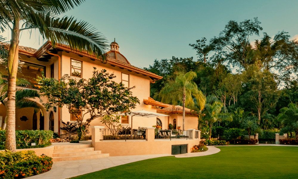Villa Firenze's entrance with lush gardens
