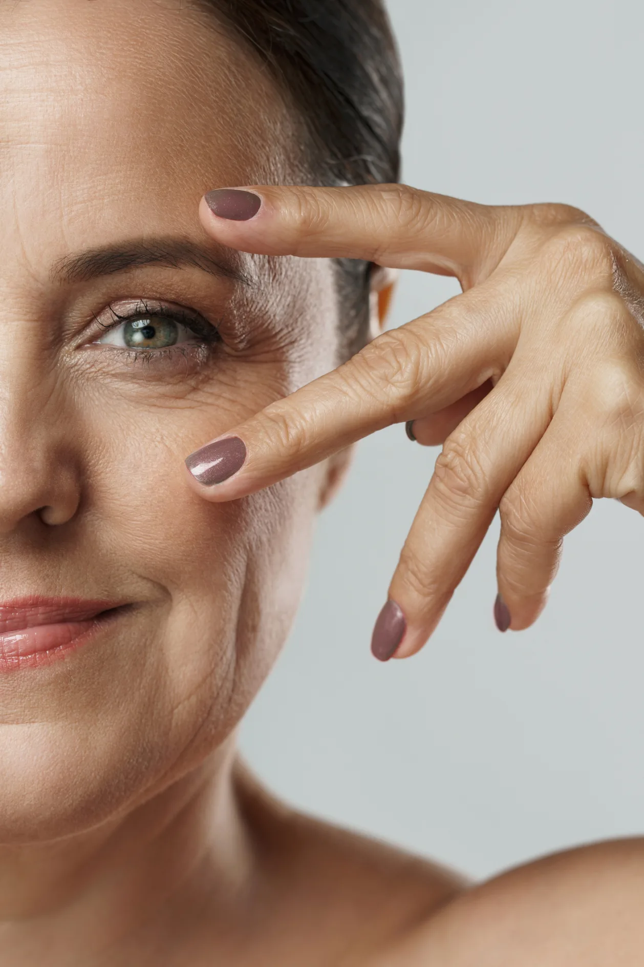 Beautiful middle aged woman with clean wrinkled skin
