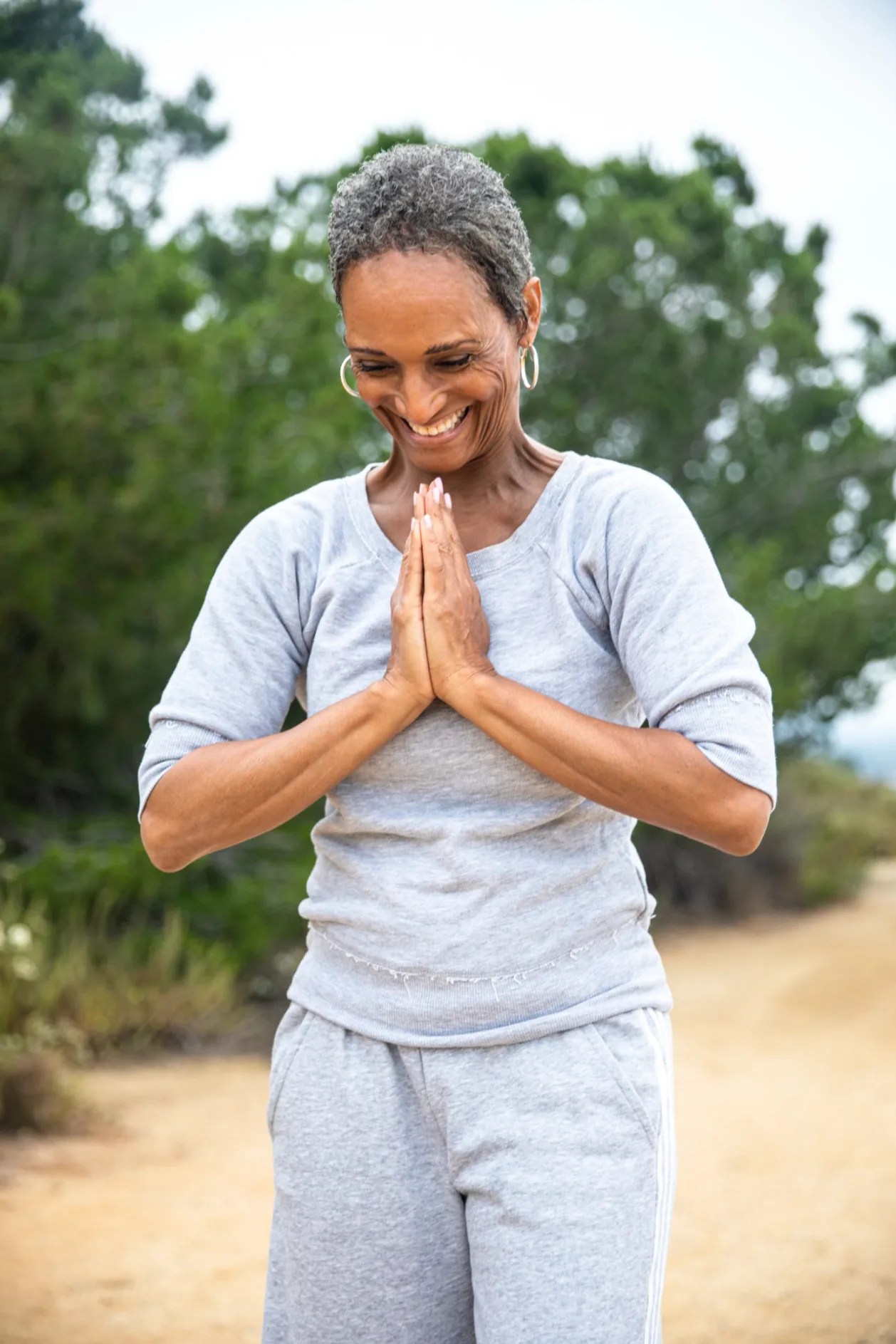 mature black woman outdoor yoga menopause wellness