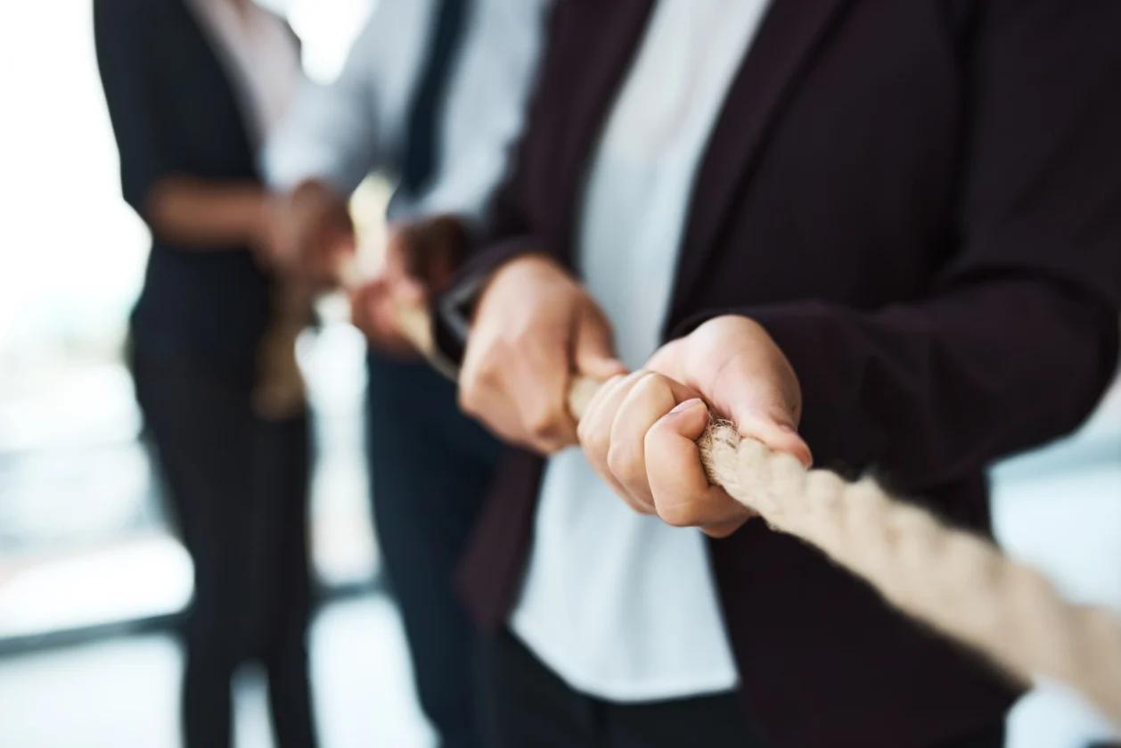 cropped shot unrecognizable business people tug-of-war corporate retreat
