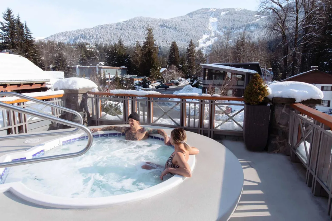 Nita Lake Lodge couple in outdoor Jacuzzi